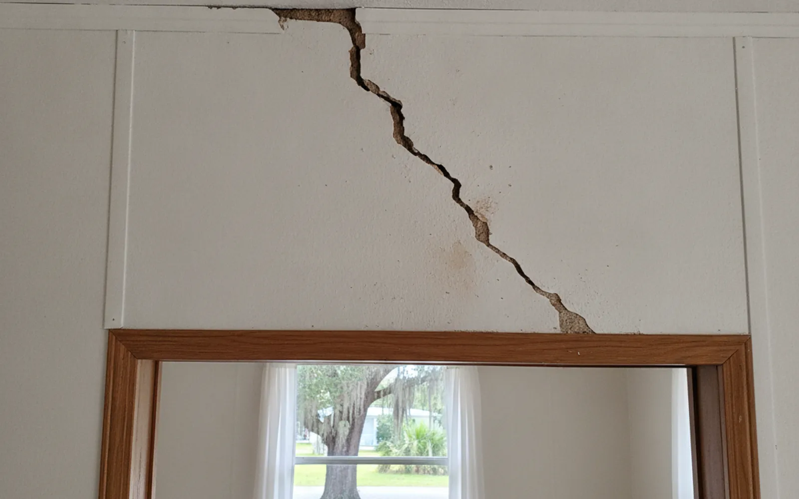 Drywall crack above a mobile home doorway